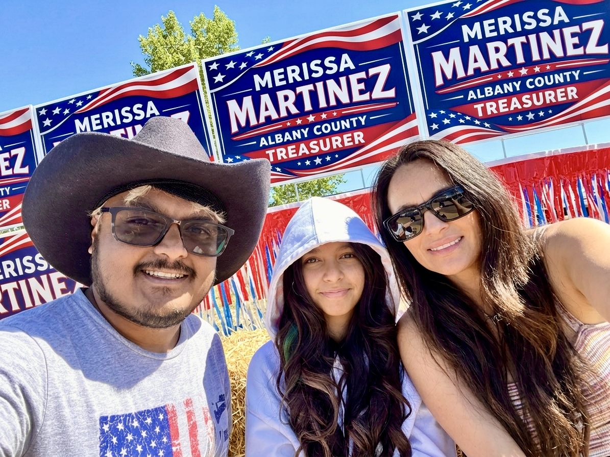 Supporters standing with Merissa Martinez for Albany County Treasurer campaign signs